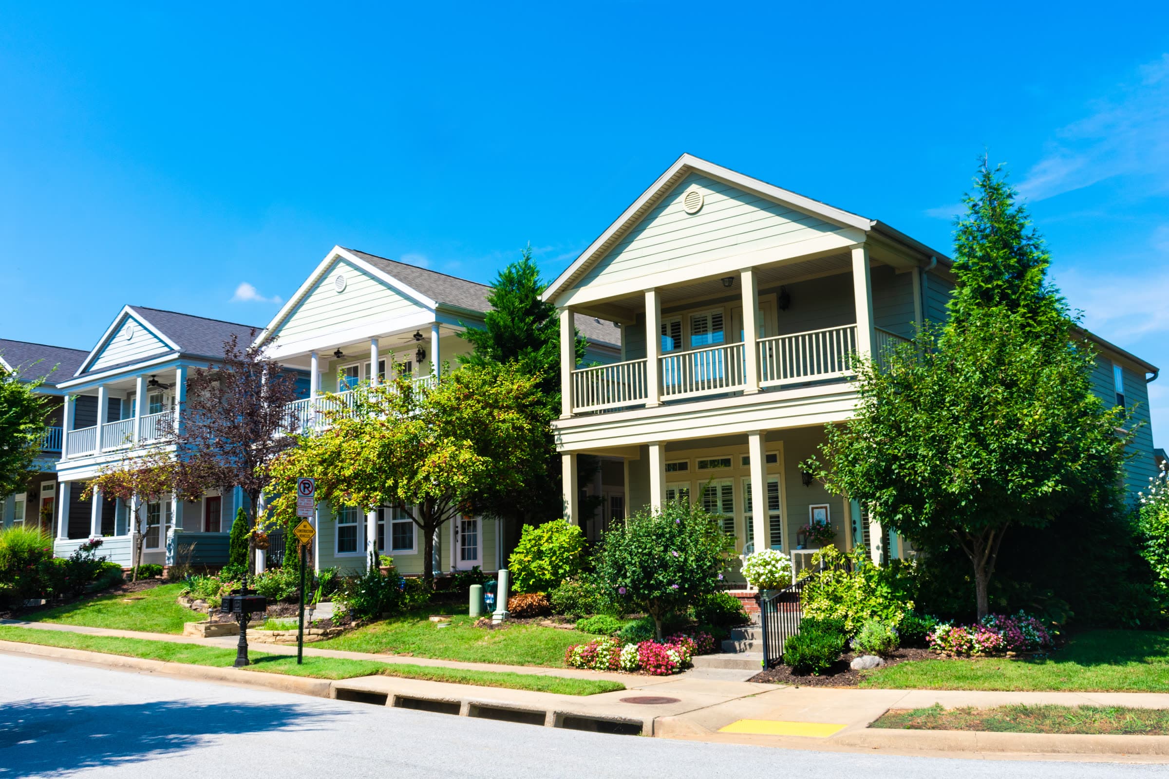 Two-story houses with front porches on a Fayetteville, Arkansas street