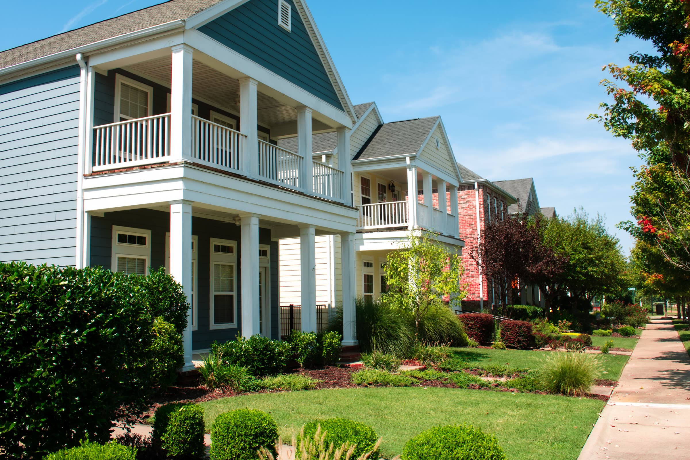 Two-story homes with covered porches on a Fayetteville, Arkansas street