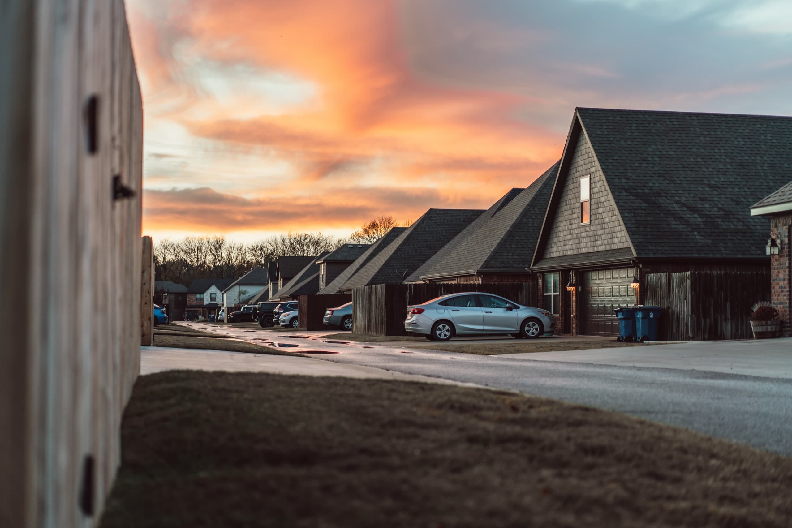 A residential street in Bentonville, Arkansas at sunset